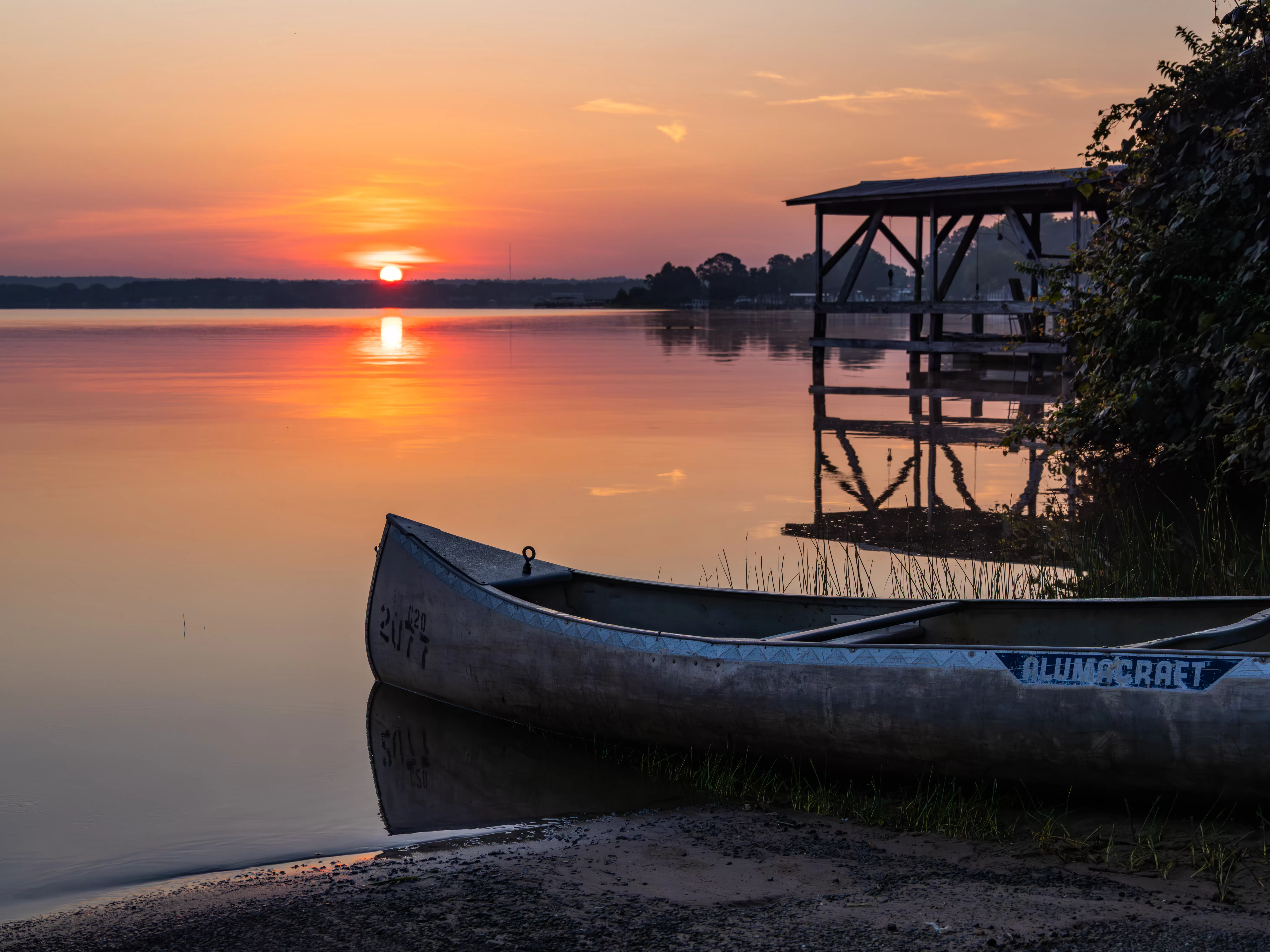 Canoe on the shore at sunset