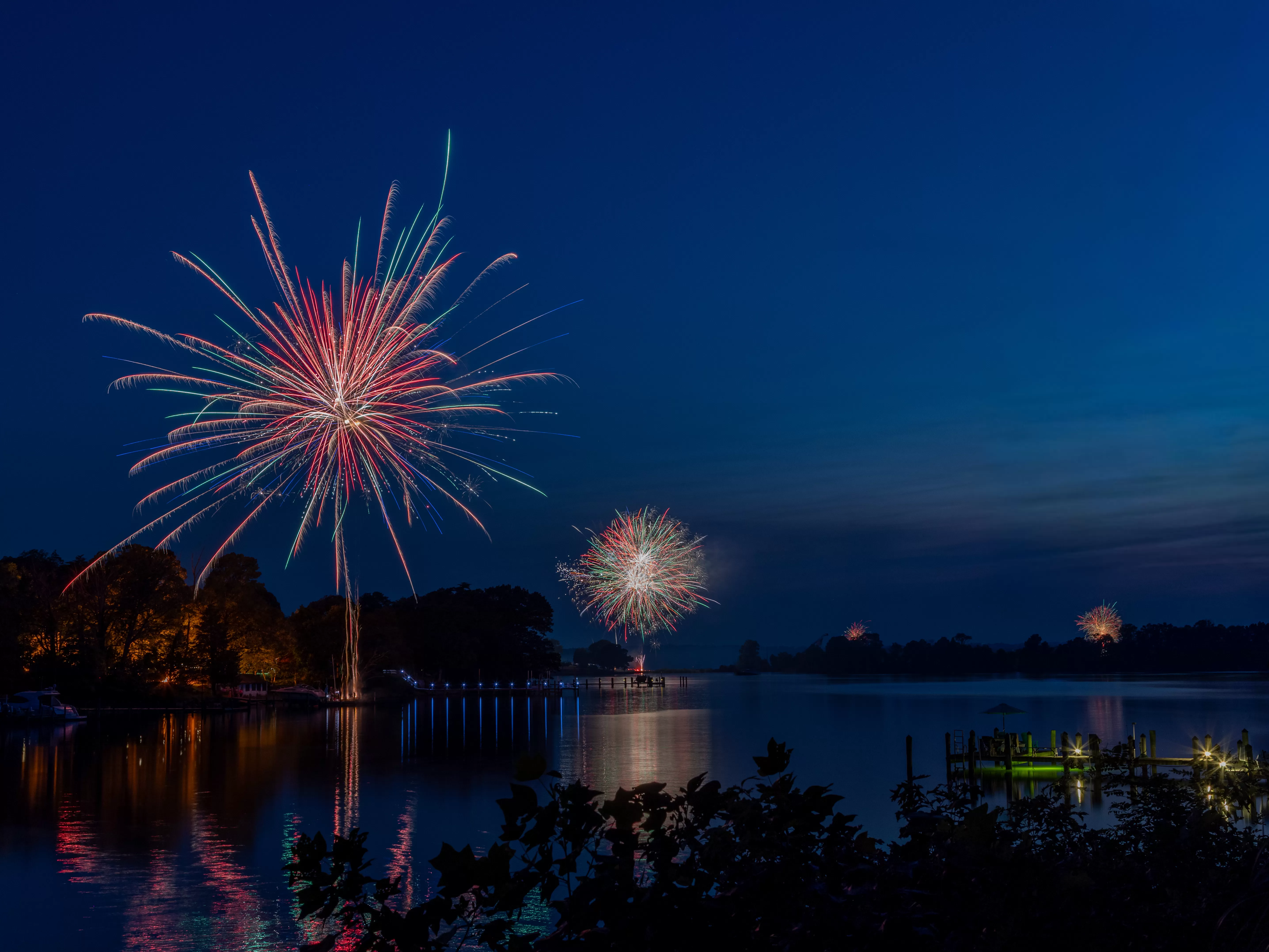 Fireworks at dusk on docks